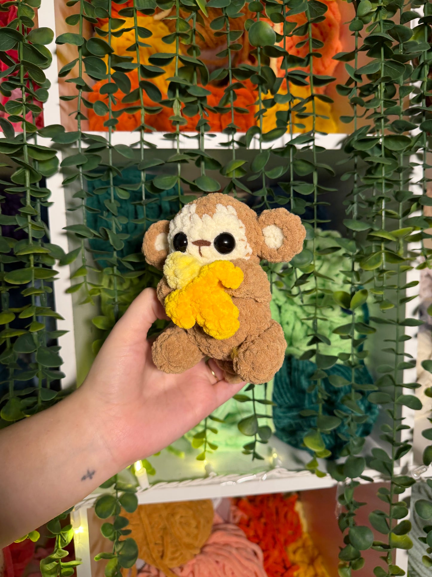 Baby Monkey Holding Banana