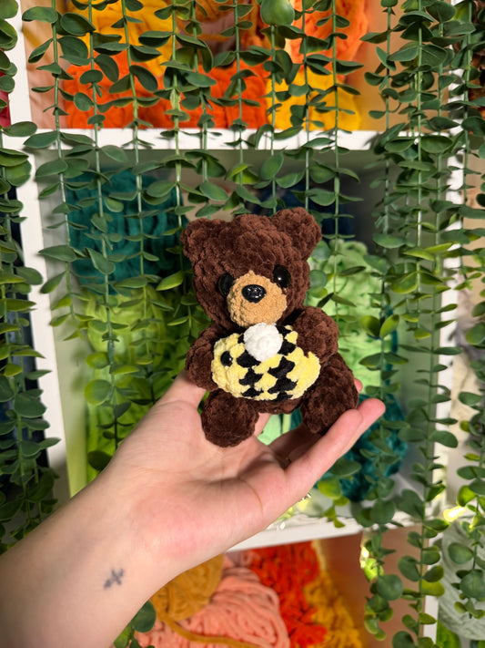 Baby Bear Holding Bee