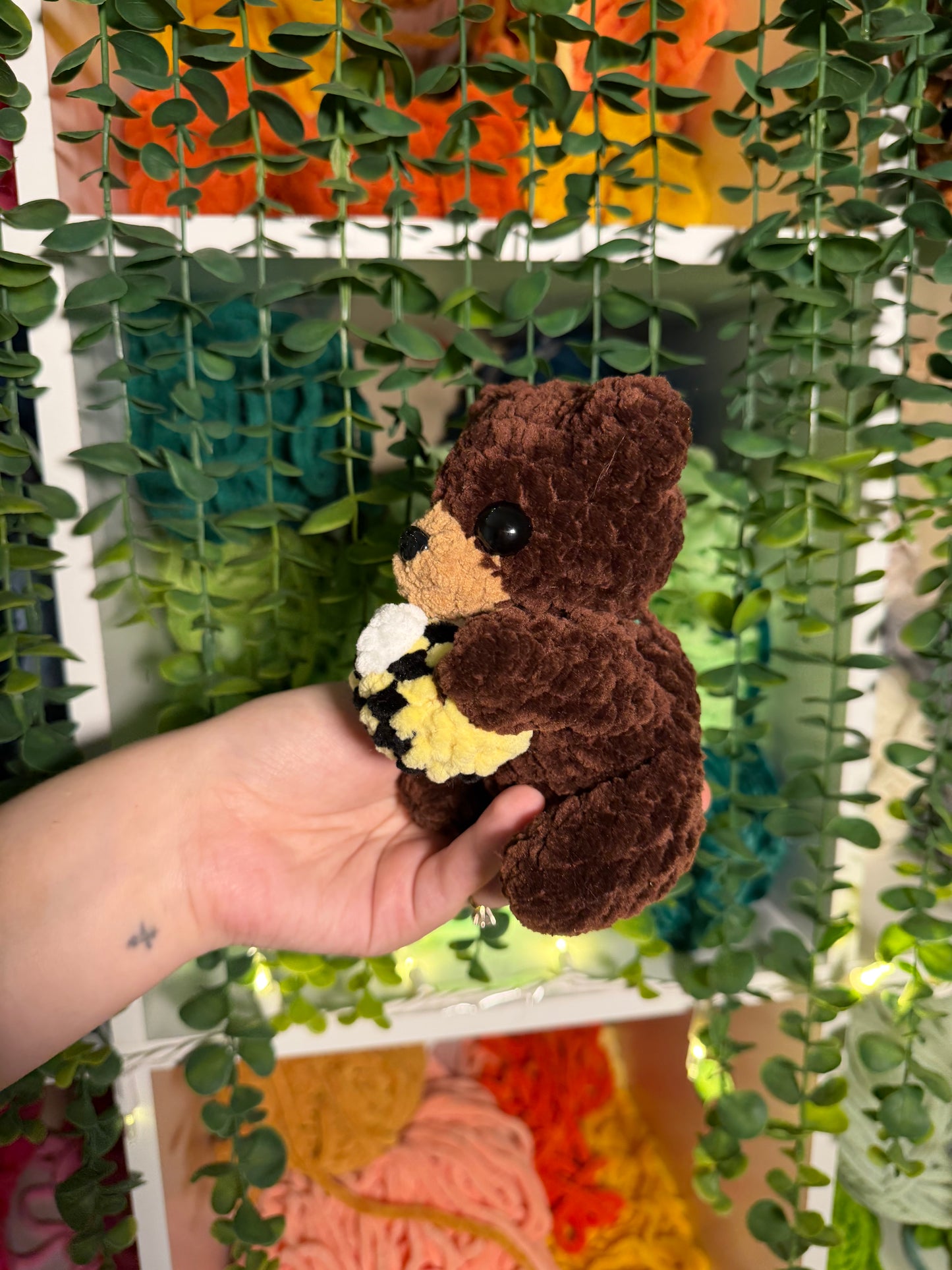 Baby Bear Holding Bee