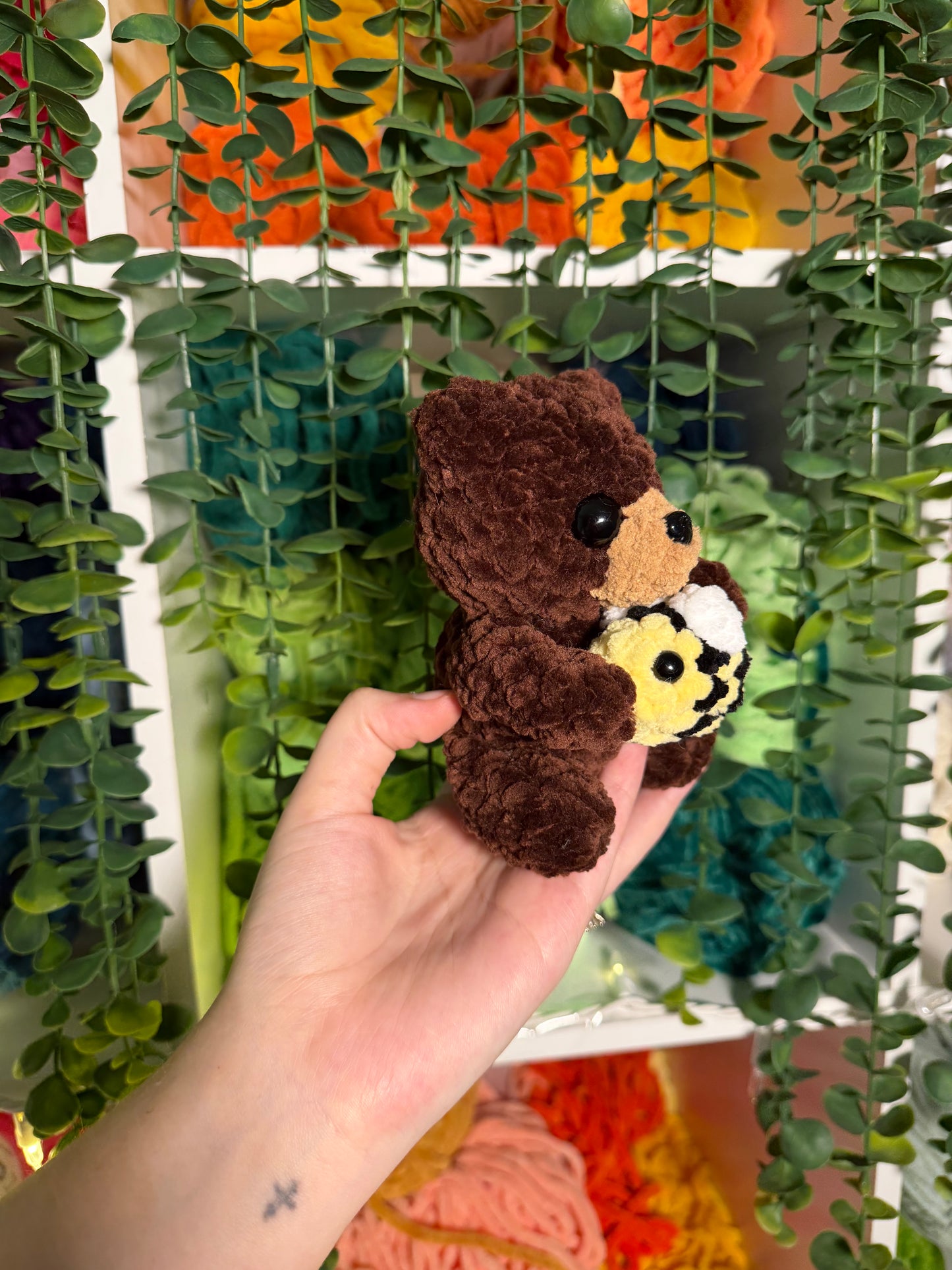 Baby Bear Holding Bee